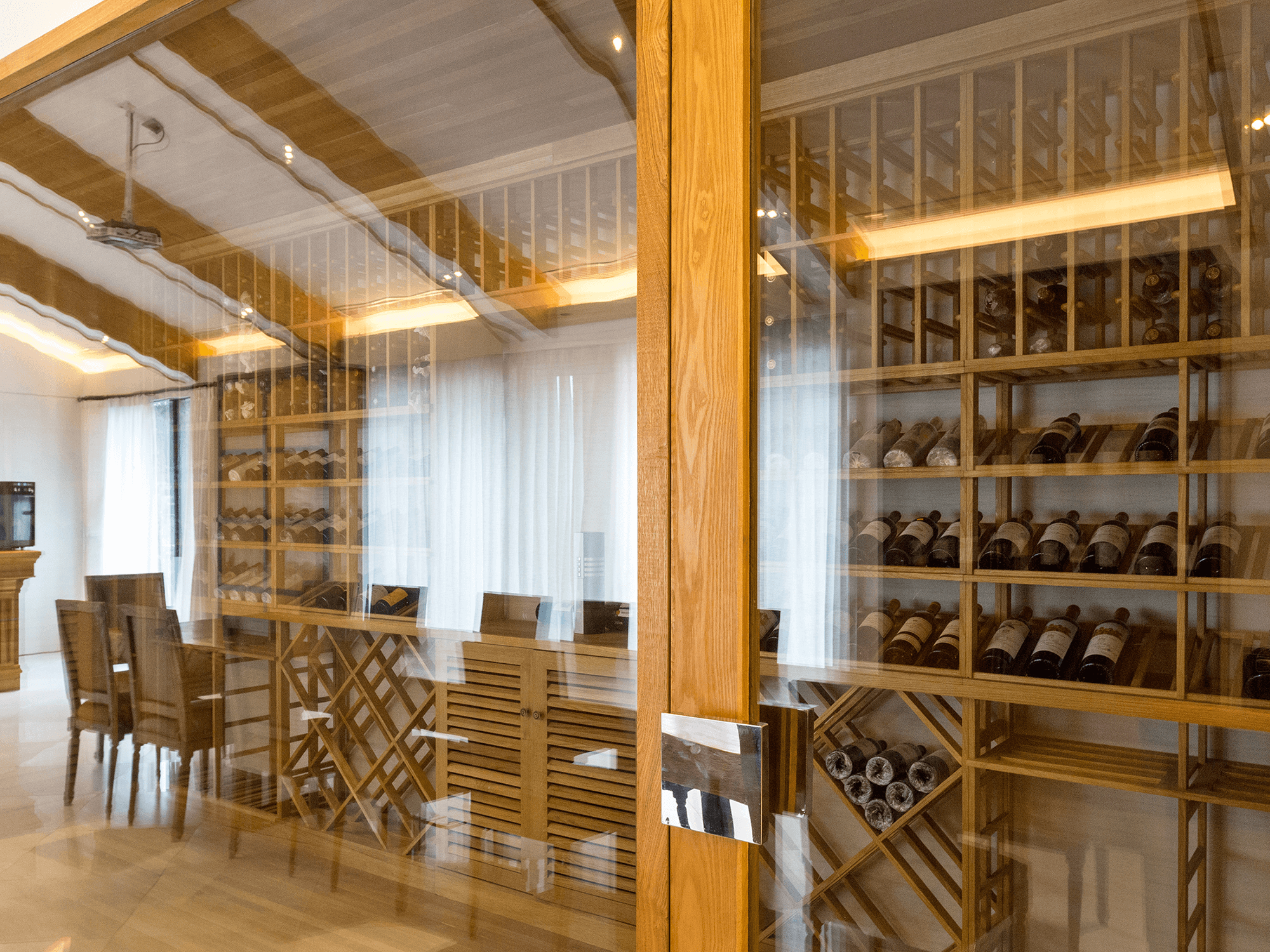 Custom wine cellar design detail in Green Tree Country Club Estates, Midland TX with walnut racking