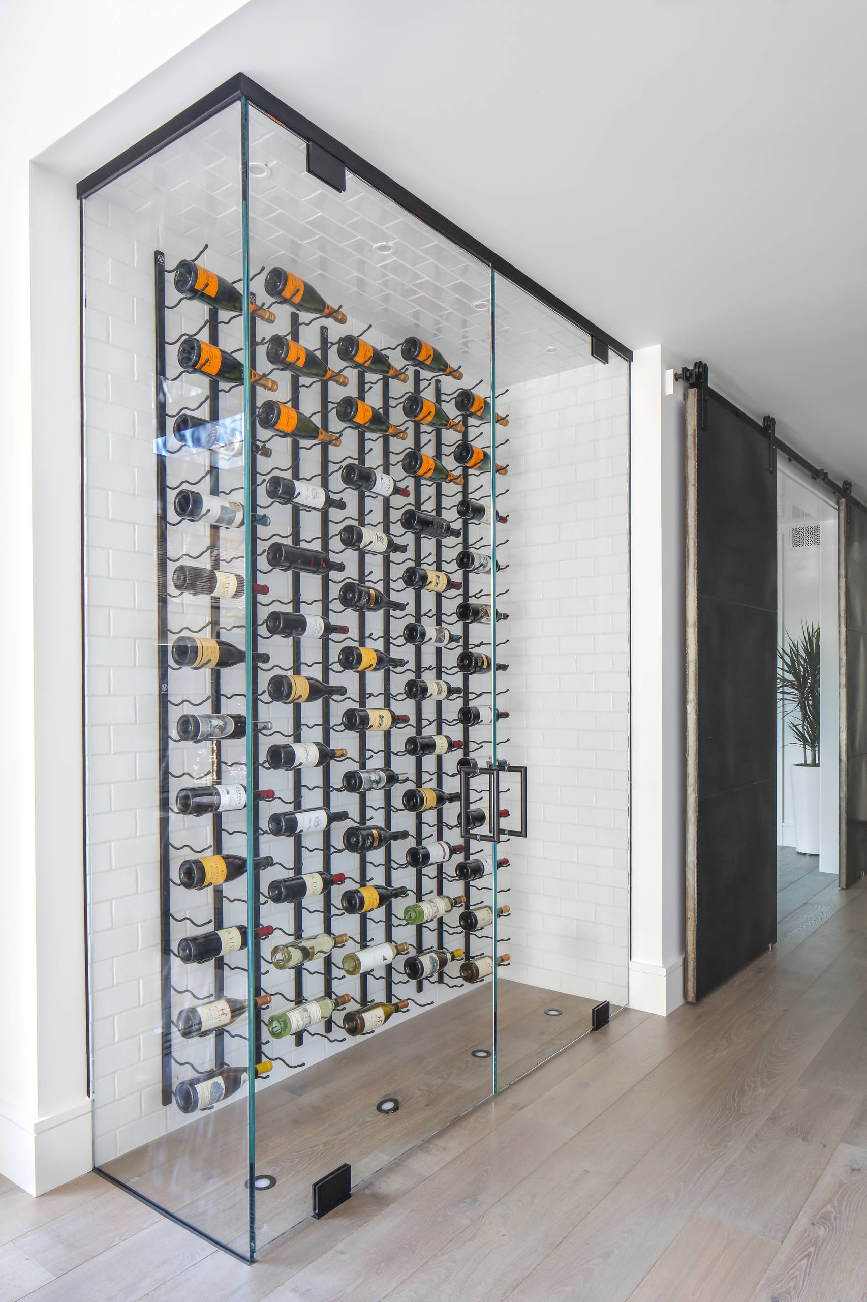 Polo Park, Midland TX minimalist wine wall with floating metal displays