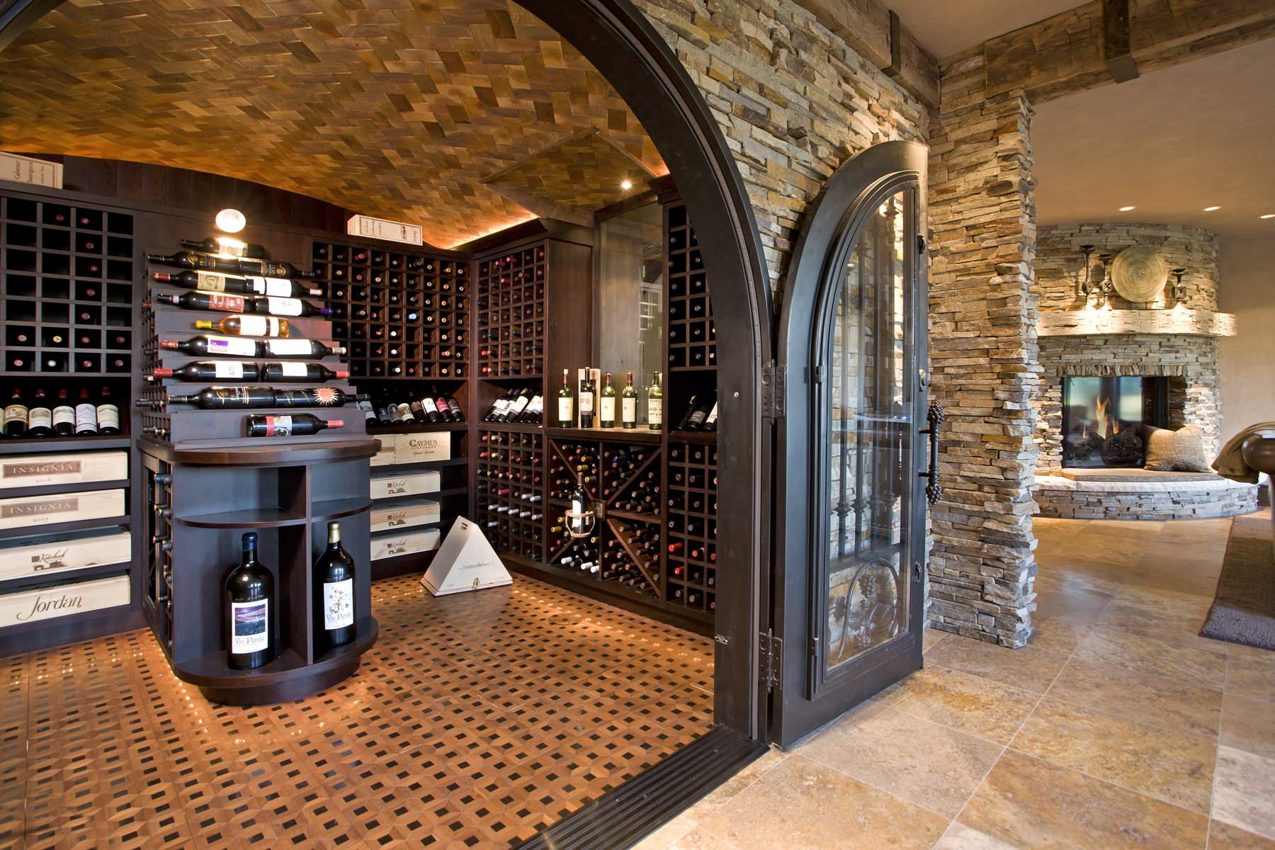 Rustic custom wine room with reclaimed wood and stone in Midland, TX
